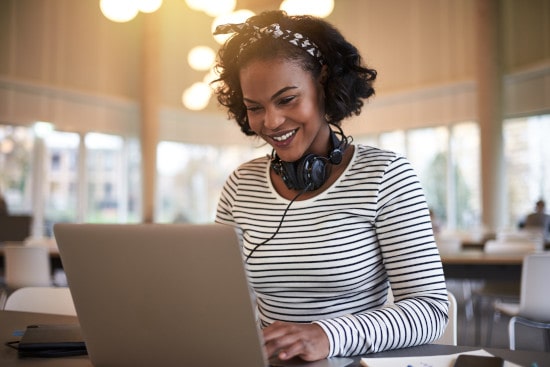 young-african-university-student-using-a-laptop